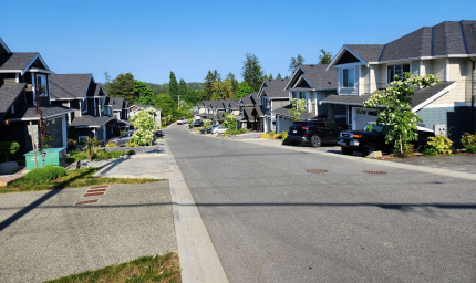 Street of detached homes at Timber Ridge Phase 1 in Central Saanich, built by Walking Stick Developments Inc.